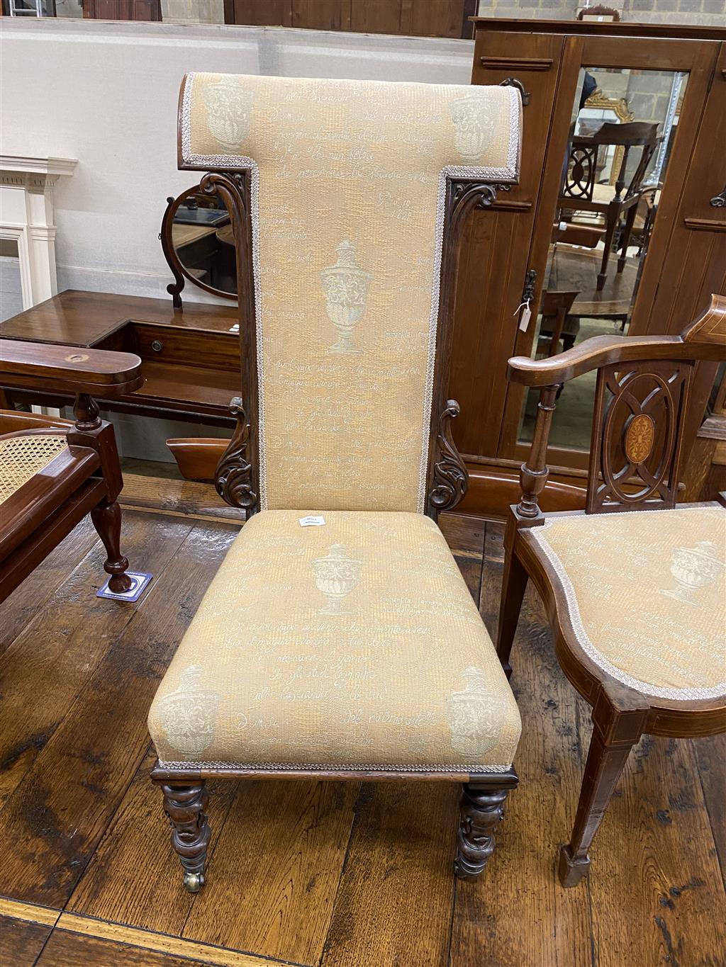 A Victorian carved mahogany framed prie dieu and an Edwardian inlaid mahogany corner elbow chair